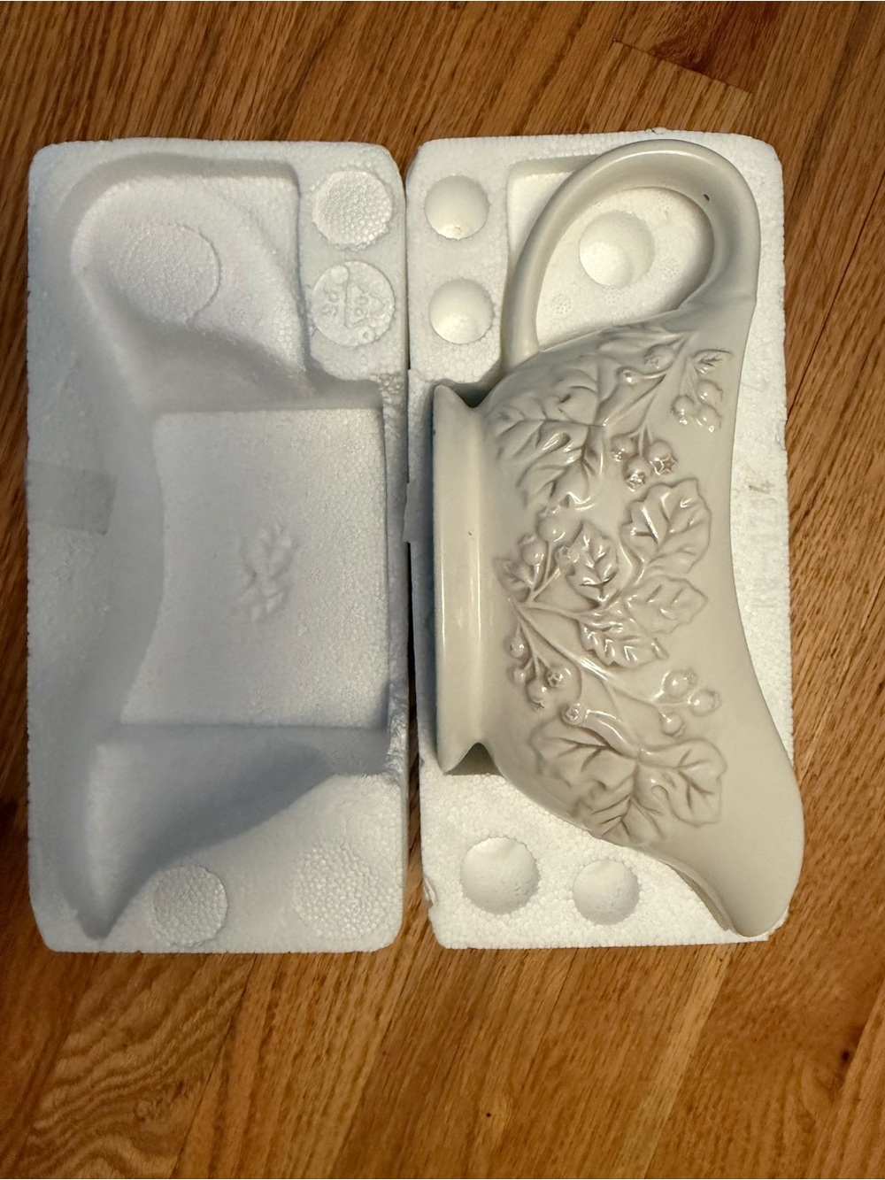 Ivory Ceramic Pitcher with Raised Leaf Motif